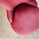 Red velvet toad armchair with fringes