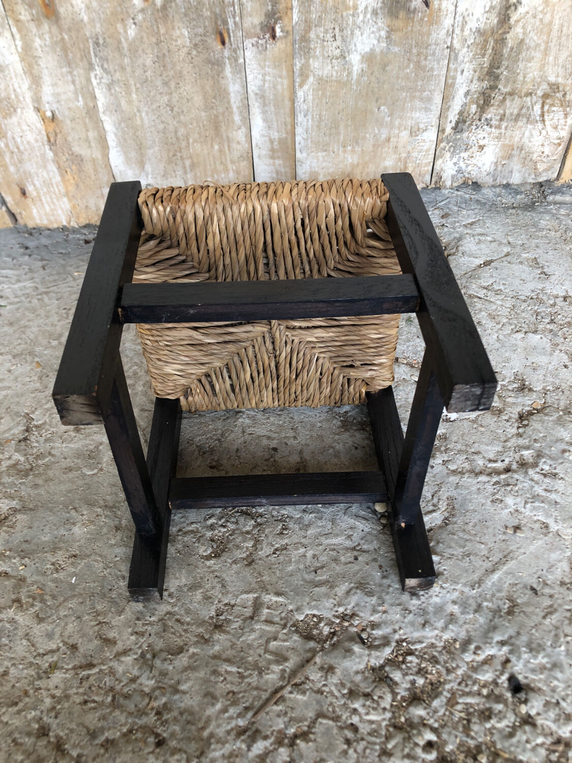 Black wood foot rest stool & vintage mulched seat
