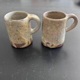 Pair of signed stoneware mugs