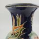 Large multicoloured ceramic vase with floral decoration signed NT.