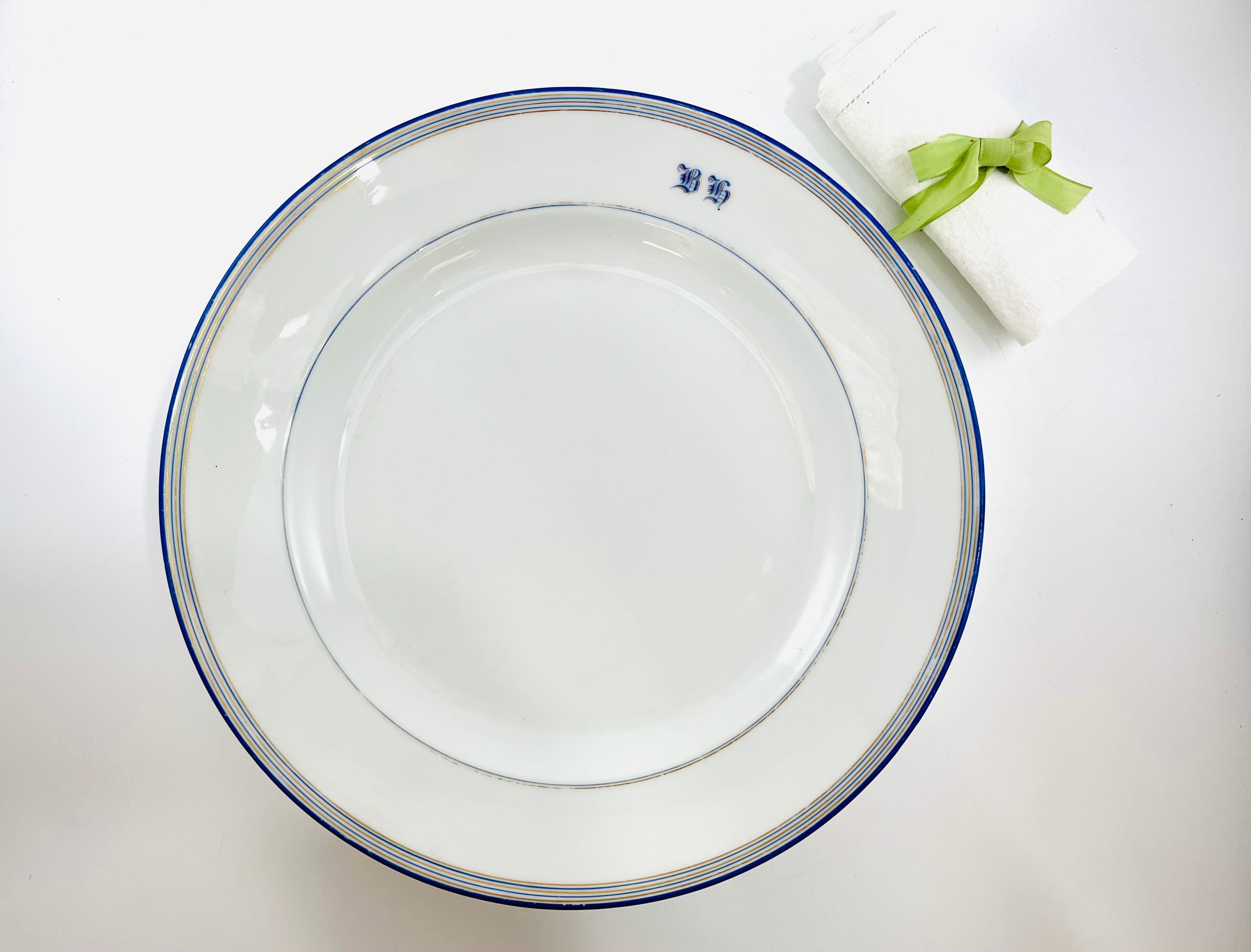 Round dish white monogrammed with blue border 34cm