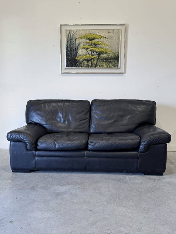 Canapé vintage Roche Bobois – modèle Soleil Noir – cuir noir patiné – 2 places
