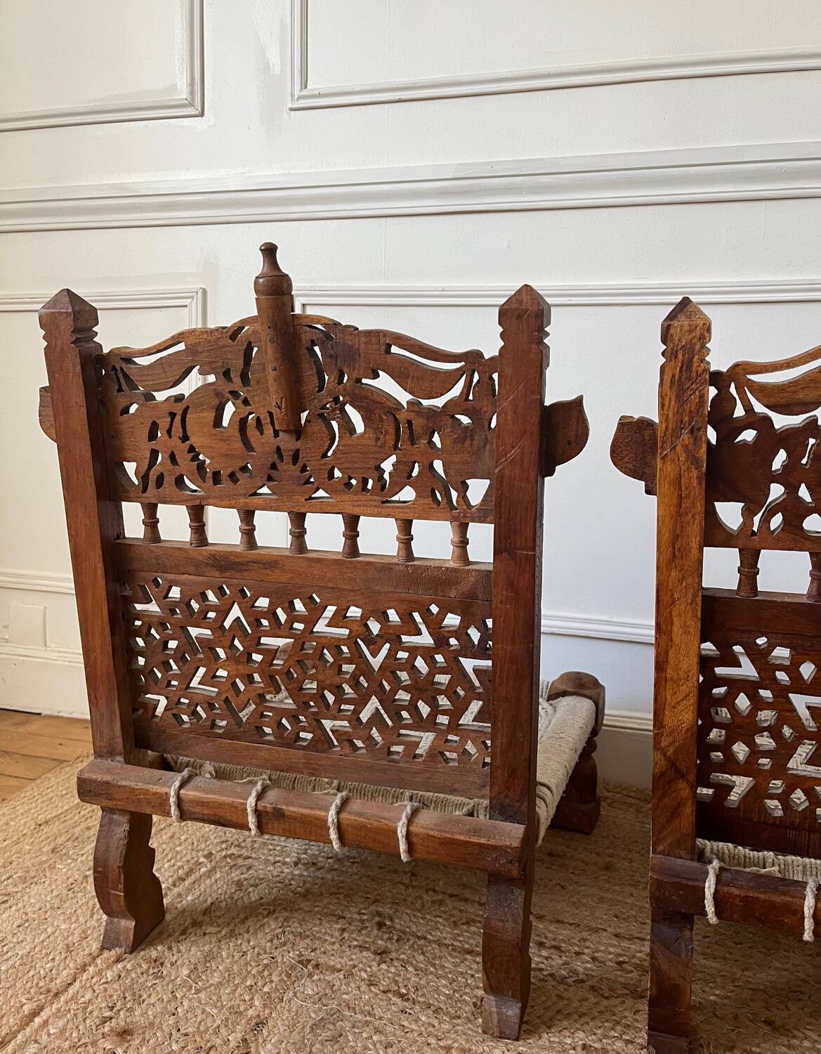 Pair of traditional Indian chairs made of carved wood and rope