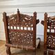 Pair of traditional Indian chairs made of carved wood and rope