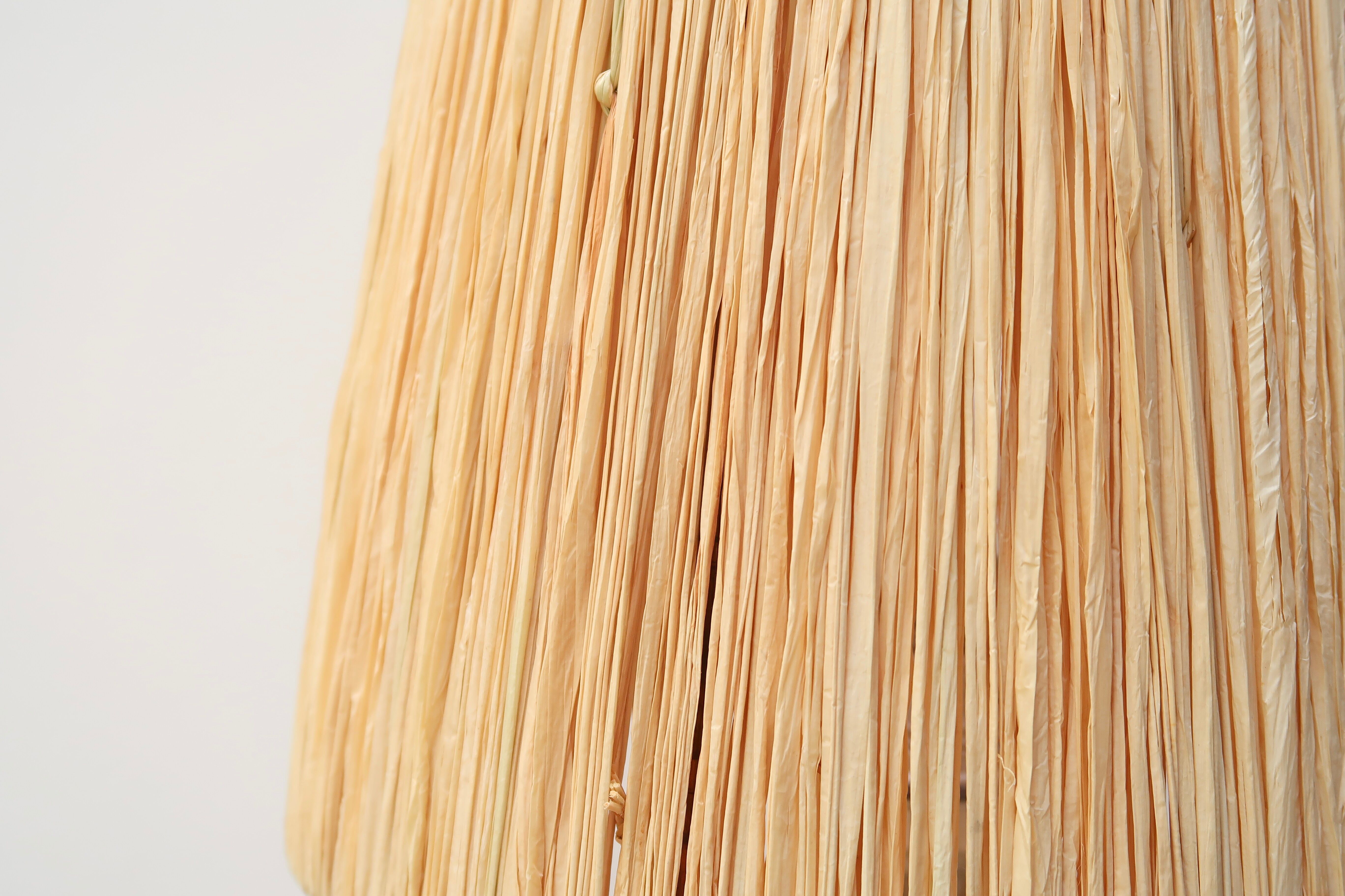 Wooden "totem" lamp, raffia lampshade, 70s