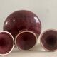 Candlesticks and bowl in speckled ceramic.