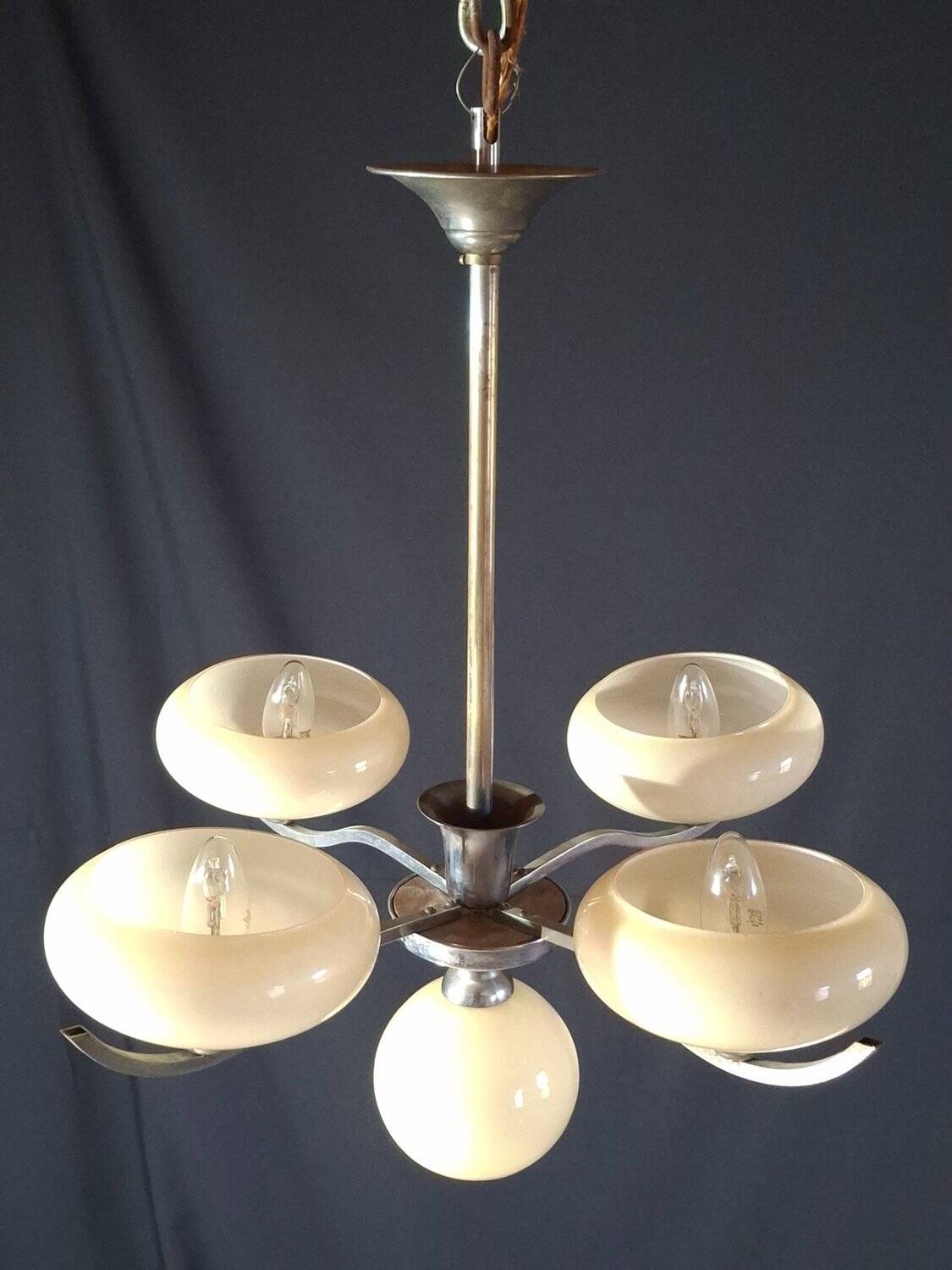 Chrome metal chandelier with 5 pale yellow opal shades from the 1950s.