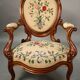 Pair of Louis Philippe armchairs with petit point upholstery.