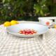 Hollow round plate duo and gravy boat in Winterling porcelain, 1970.