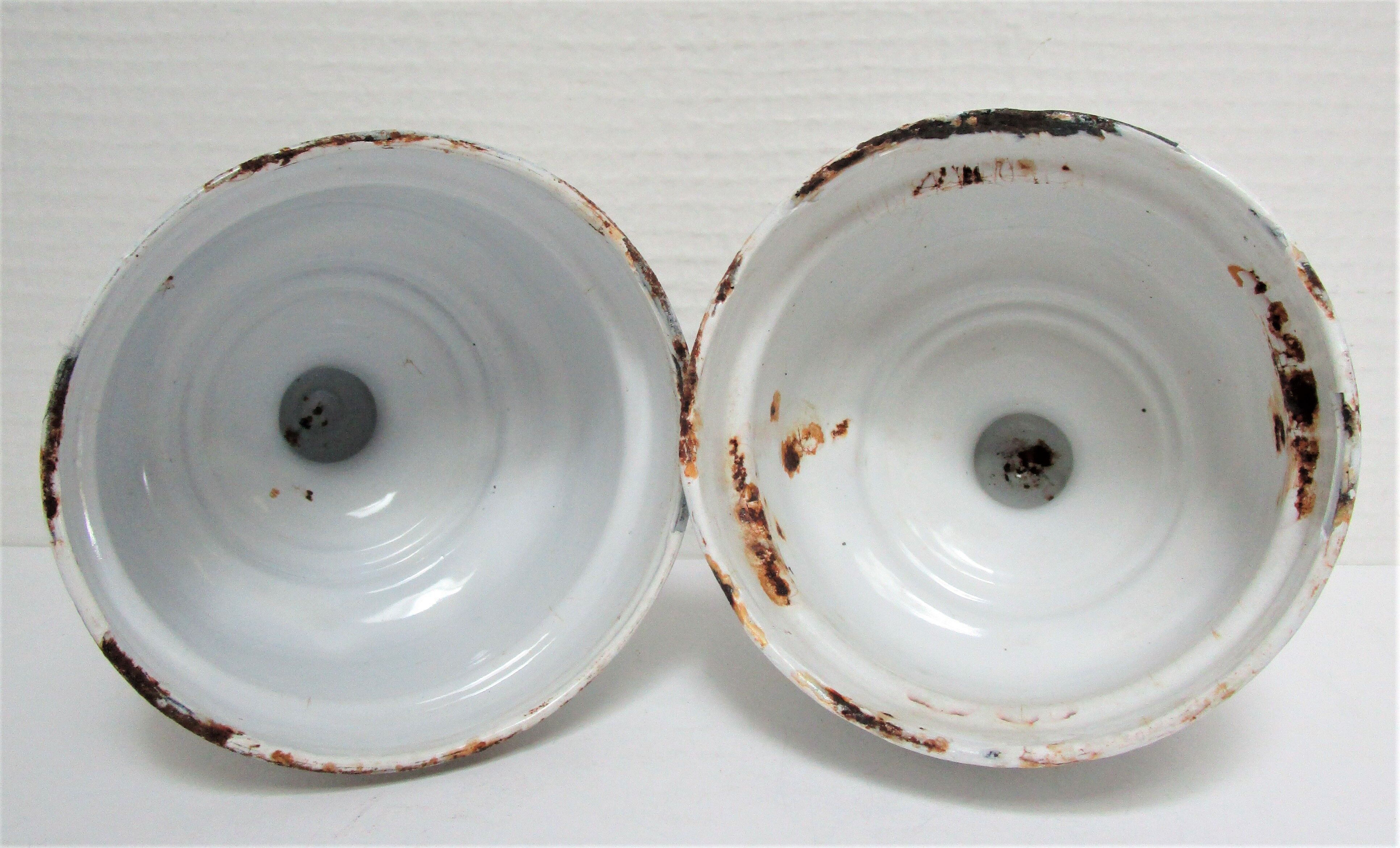 Four white enamelled metal cheese bells early twentieth century