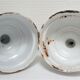 Four white enamelled metal cheese bells early twentieth century