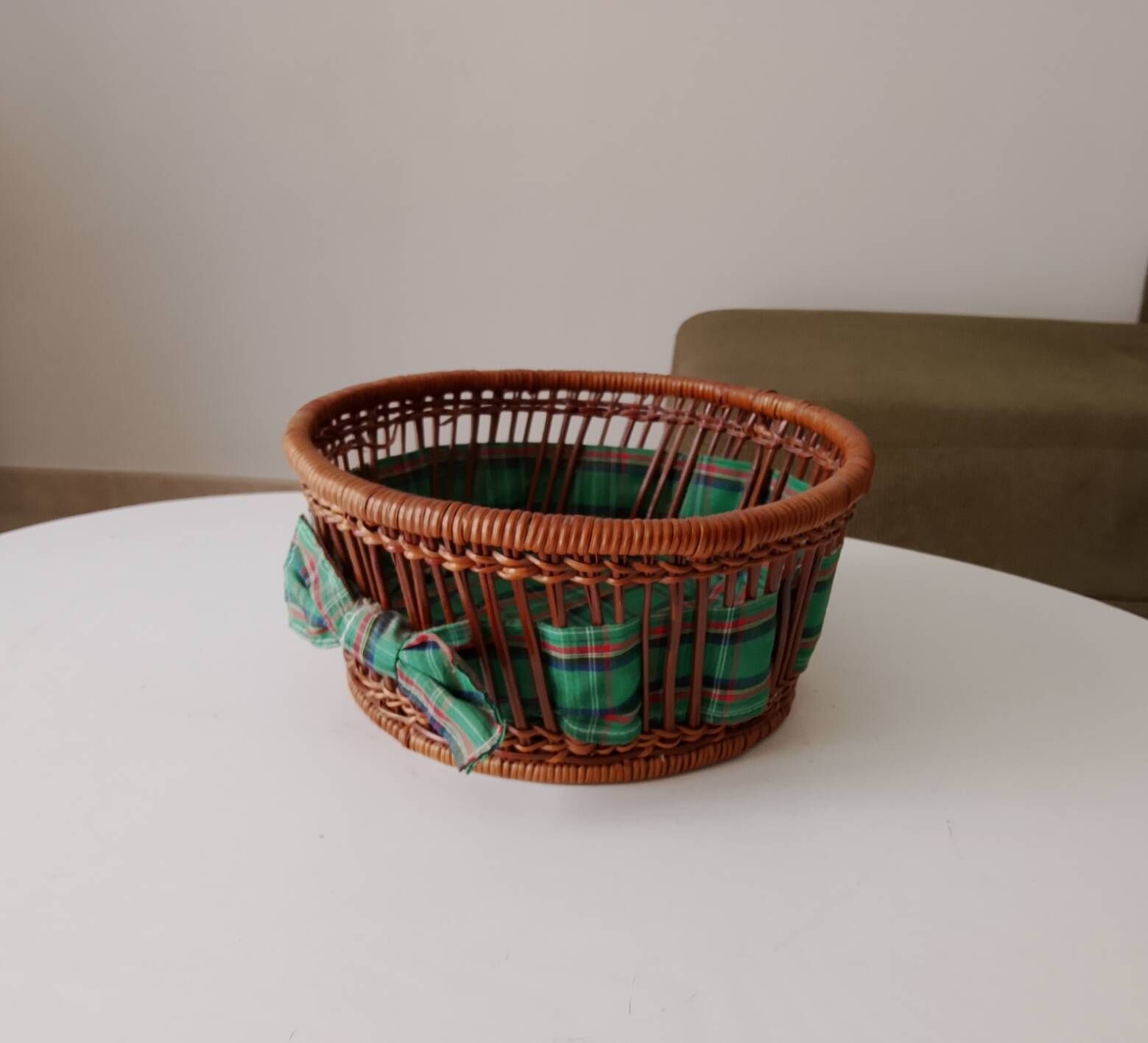 Vintage wicker and rattan basket with tartan fabric.