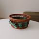 Vintage wicker and rattan basket with tartan fabric.