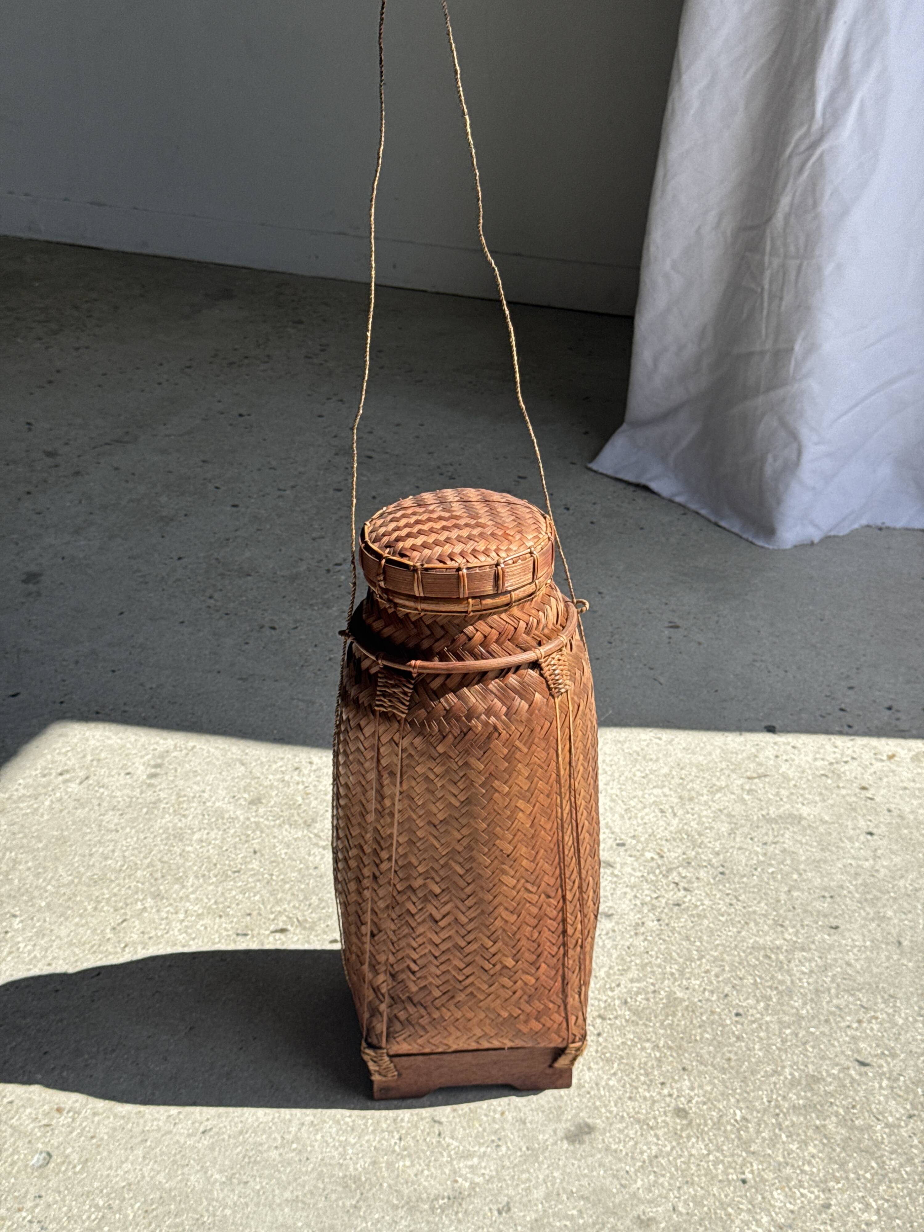 Small traditional Balinese basket with cords H47 D19 0.5kg