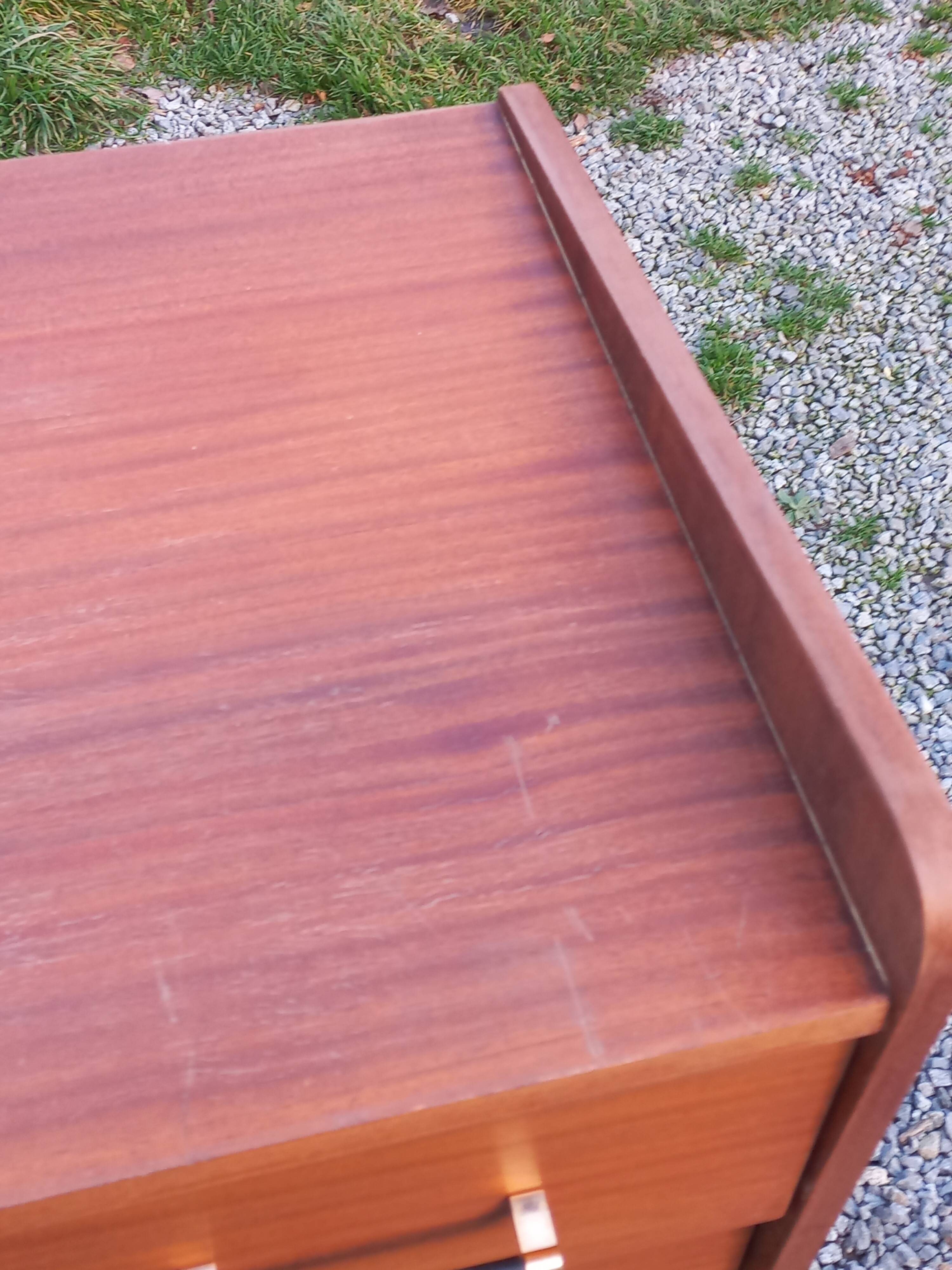 Vintage mahogany commode with metal tapered legs, 4 drawers, 1950s.