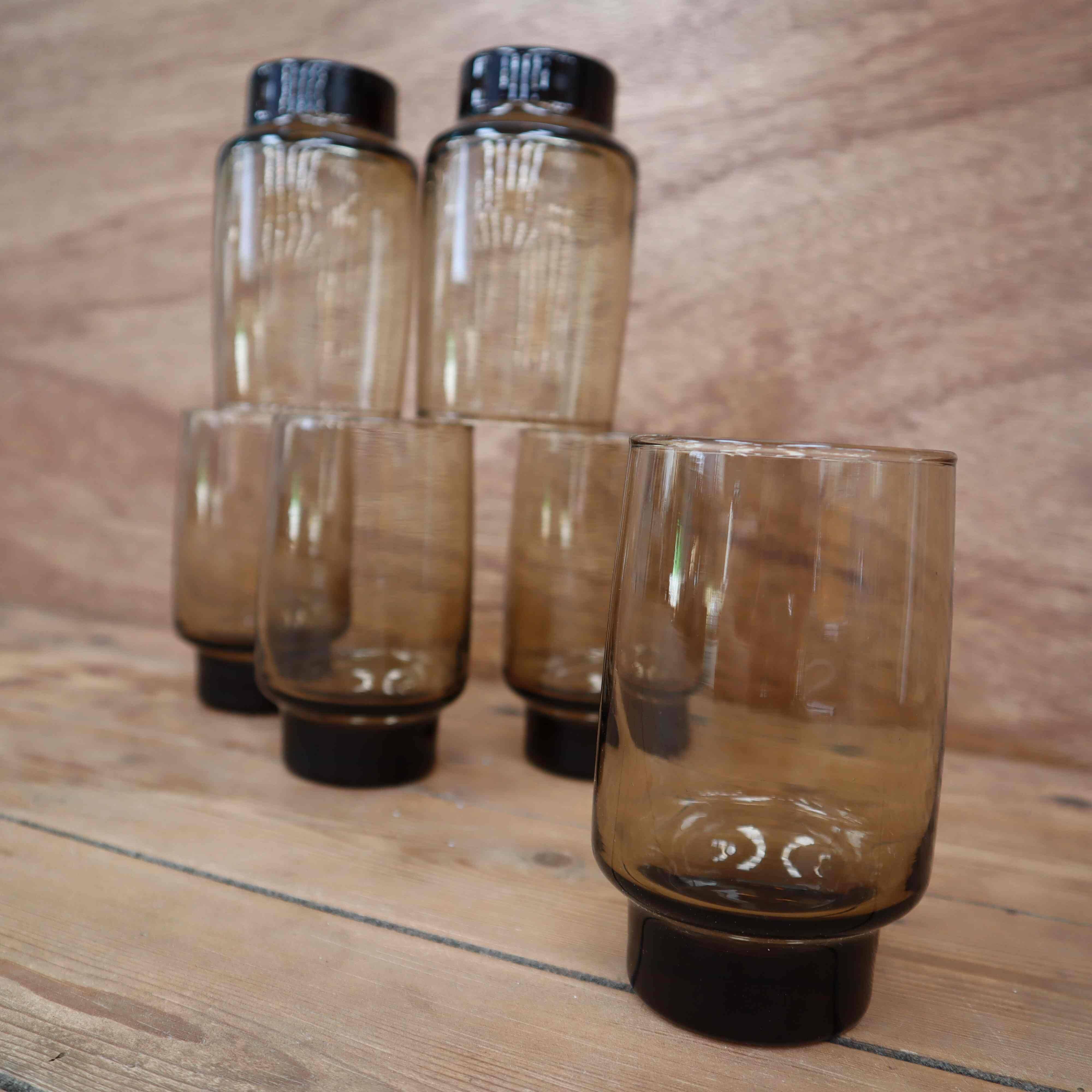 6 Smoked glasses with thick legs from the 70s
