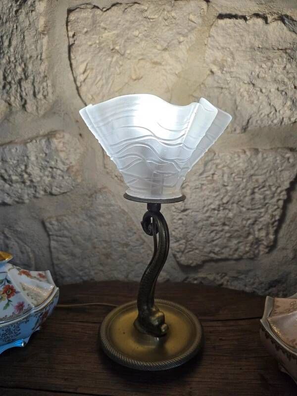 Table lamp with brass fish and draped glass tulip.