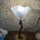 Table lamp with brass fish and draped glass tulip.