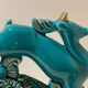 Pair of art deco bookends in enamelled ceramics, doe and hunting dogs