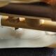 Shell-shaped wall lamp in frosted glass and vintage brass