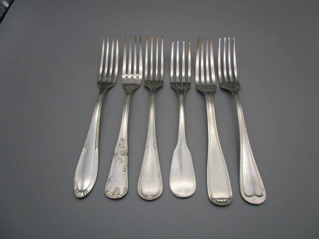 6 mismatched old silver metal forks for a chic table