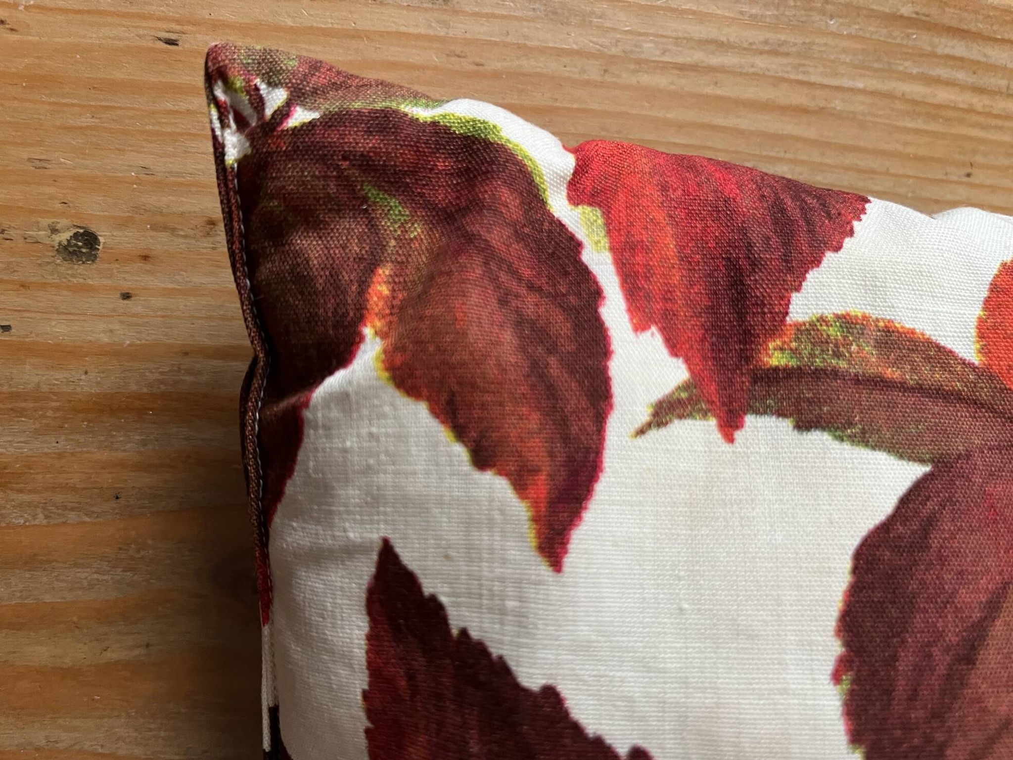 Vintage cushion with virgin vine leaf pattern.