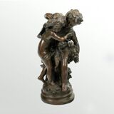 Bronze statue of two children carrying a bouquet of flowers, signed Auguste Moreau (1834-1917)
