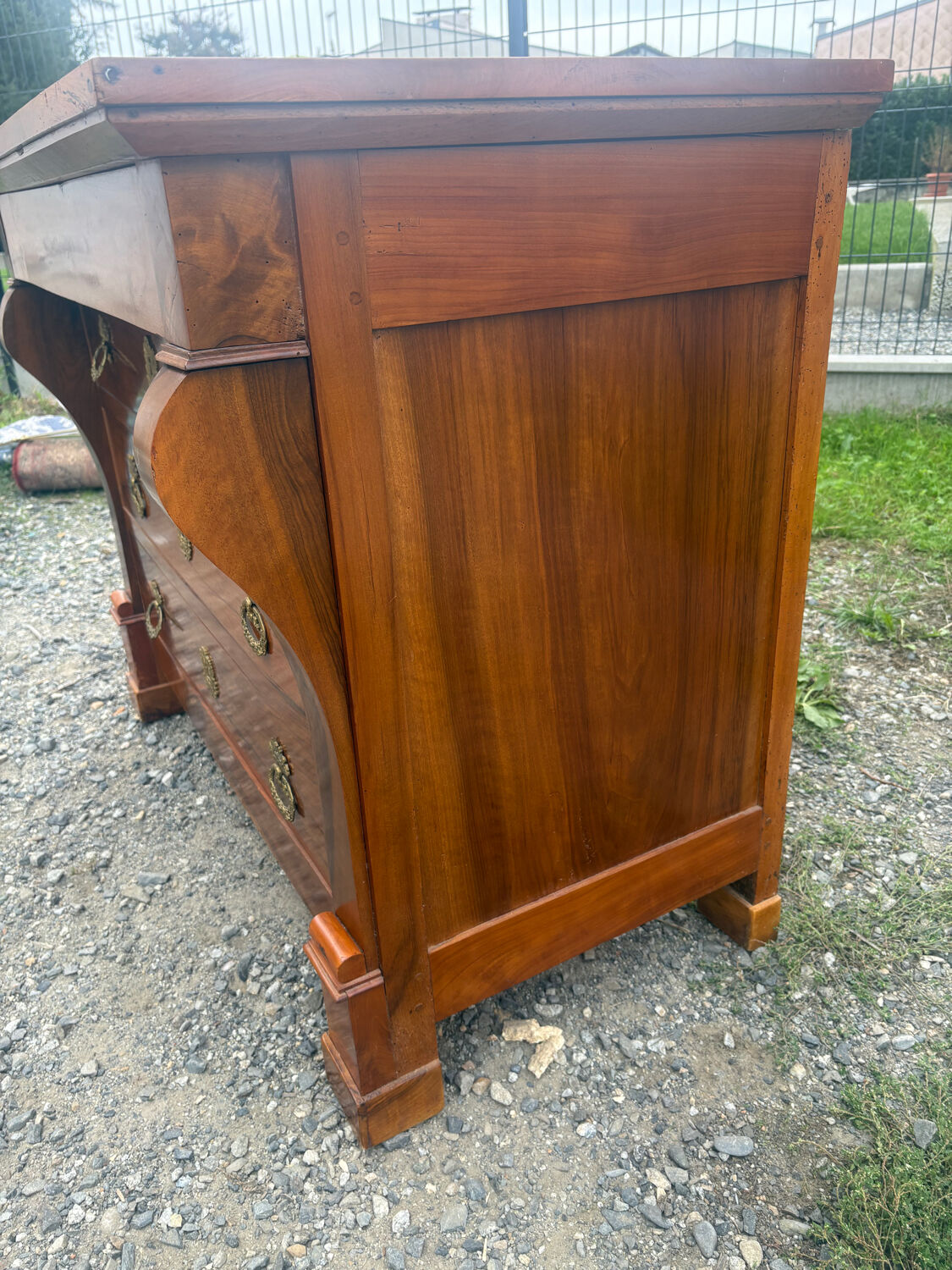 Restoration period walnut chest of drawers with a scroll handle