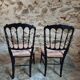 Pair of antique Napoleon III chairs in blackened wood and fabric.