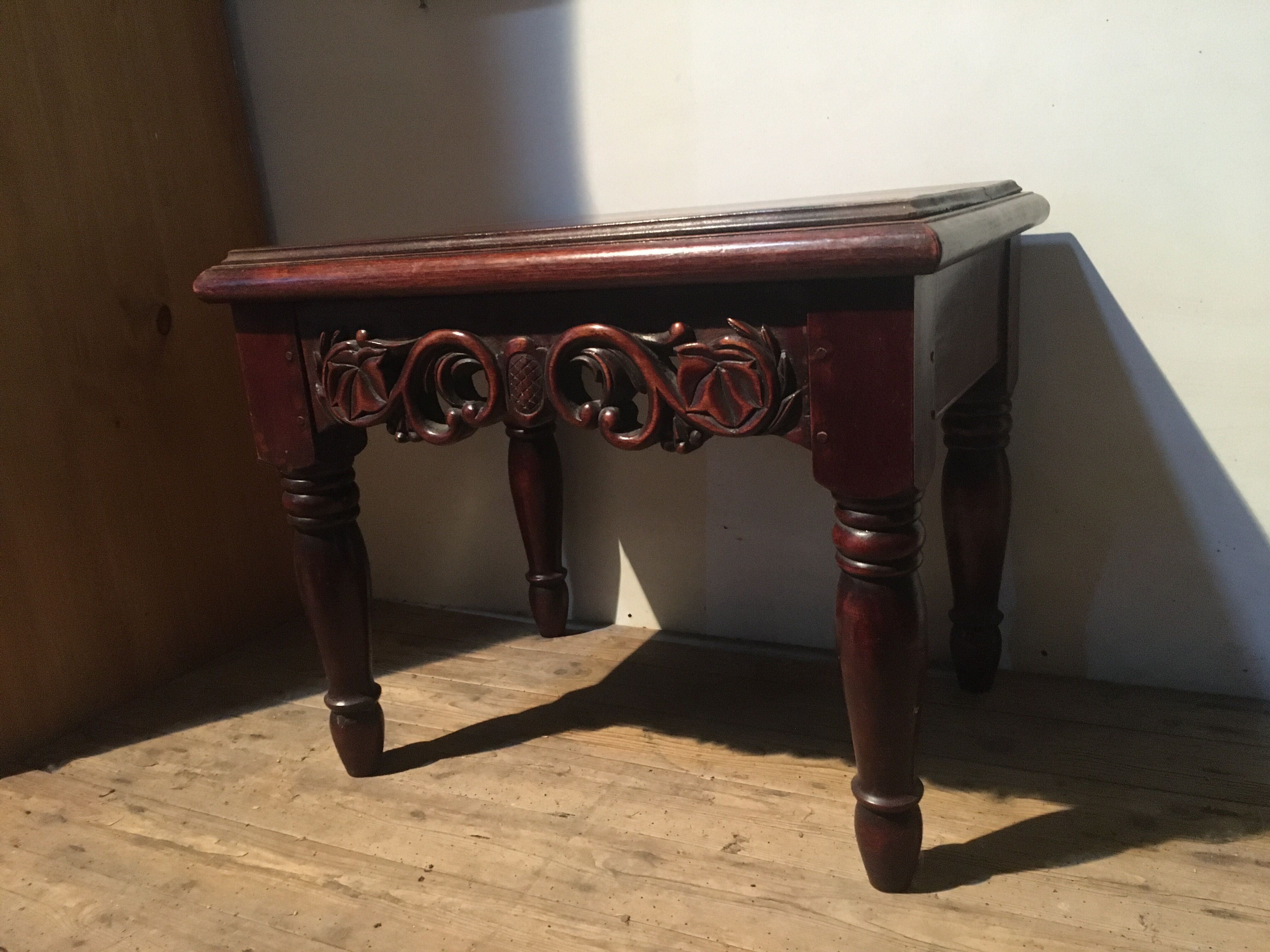 Carved wooden sofa end, mahogany