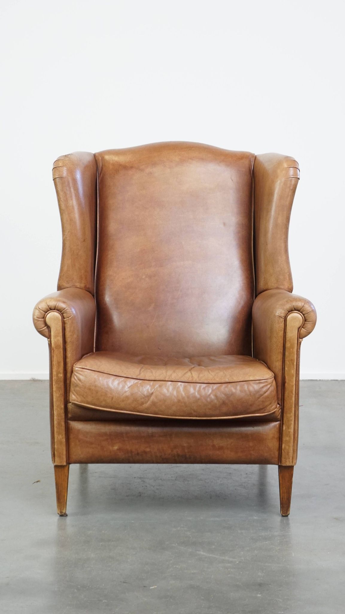 Cowhide Leather Wingback Chair in Light Cognac Color
