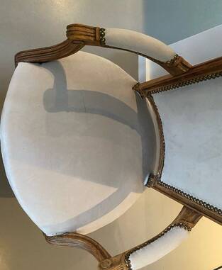 Pair of cabriolet armchairs in light grey and dark grey Louis XV style.
