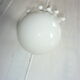 White ceramic hand wall light and white opaline globe, in perfect condition