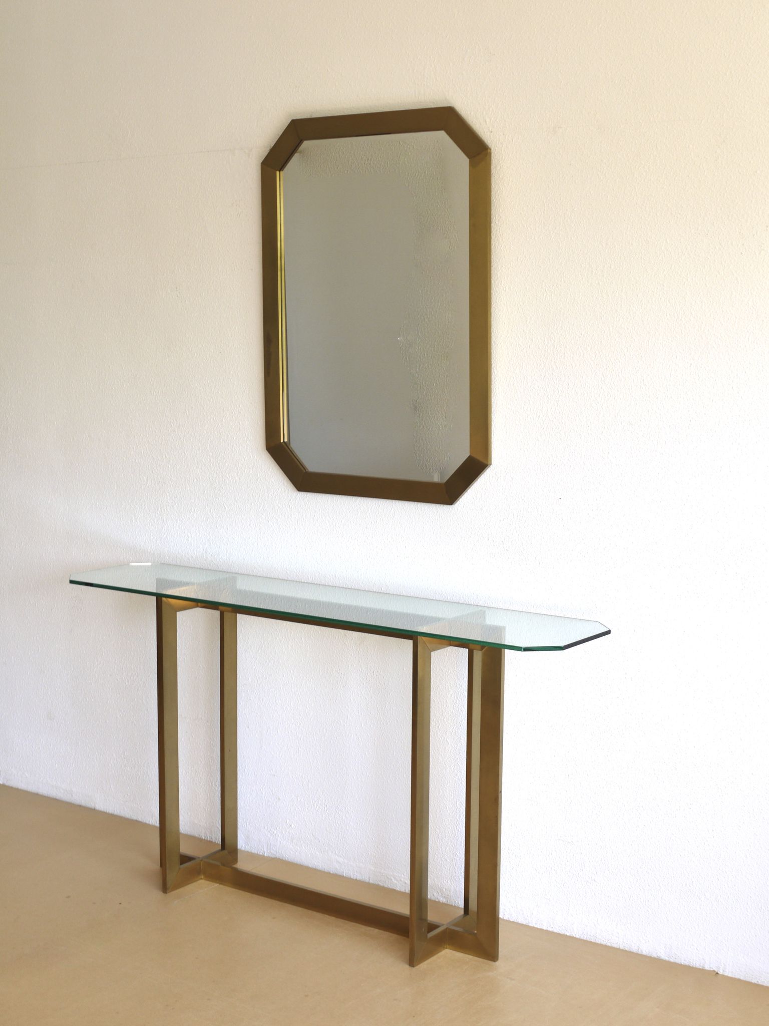 Modernist brass and glass console table & mirror. 1970s