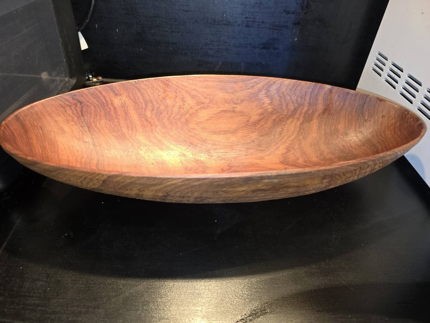 solid wood shuttle with a sleek and organic design.
