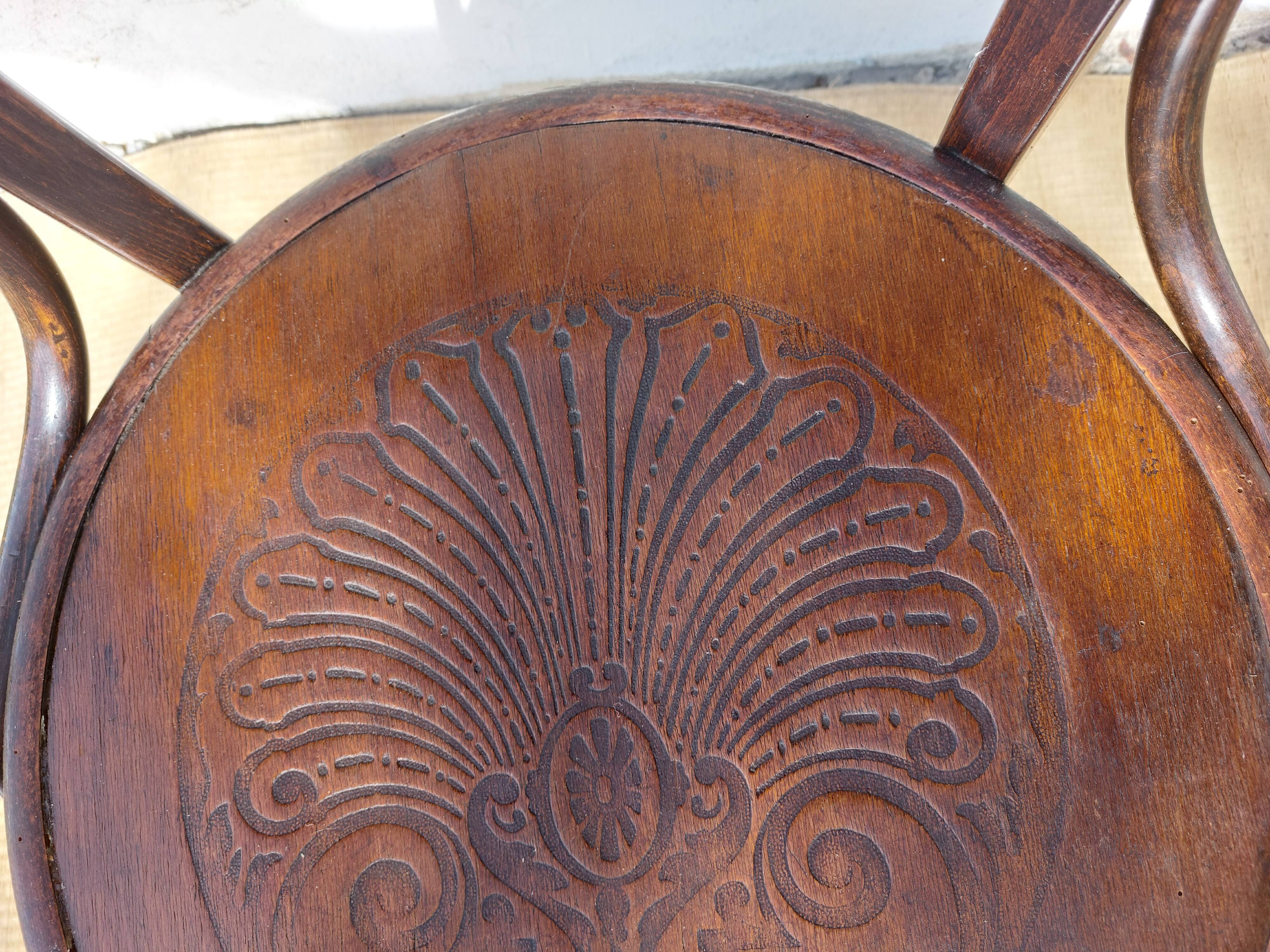 Swivel wooden armchair, pattern on seat