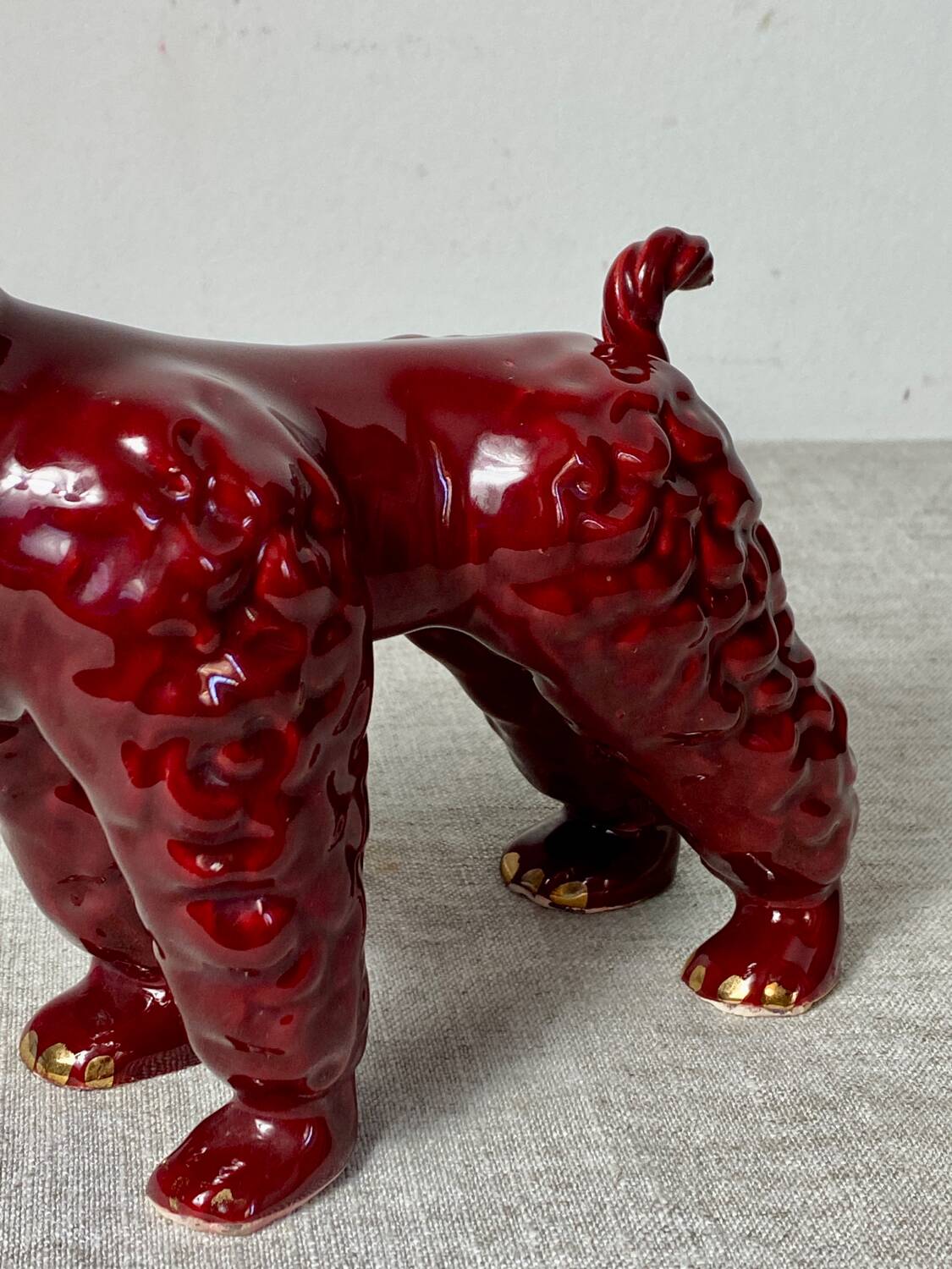 Burgundy and gold ceramic dog