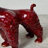 Burgundy and gold ceramic dog