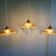 Set of three fluted amber glass pendants, 1930s.