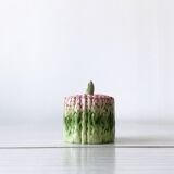 Old mustard pot and its slid in slurry decoration bunch of asparagus.