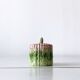 Old mustard pot and its slid in slurry decoration bunch of asparagus.