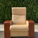 Set of vintage armchair and 2-seater sofa in beige leather and reclining wooden armrests, stressless style
