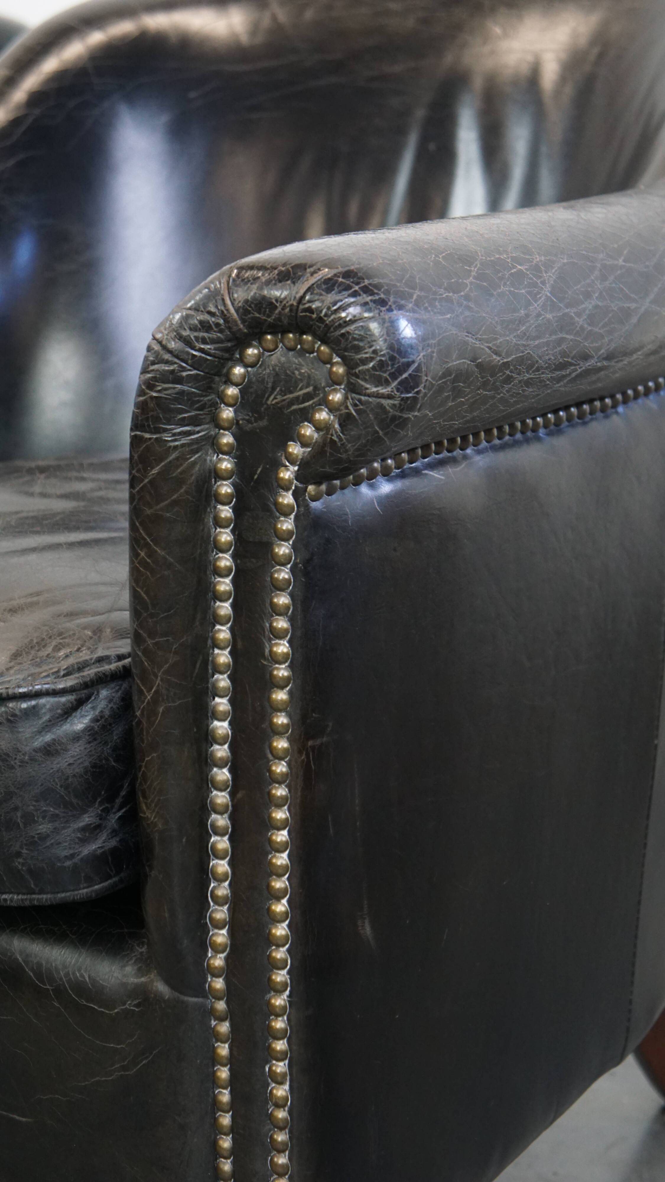 Black grained cowhide leather armchair