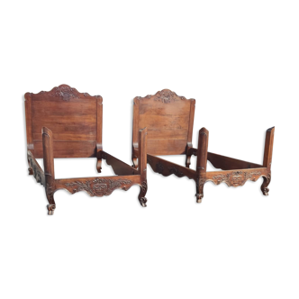 Pair of Provençal beds in carved solid walnut