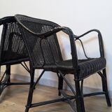 Paire de fauteuils noirs en rotin