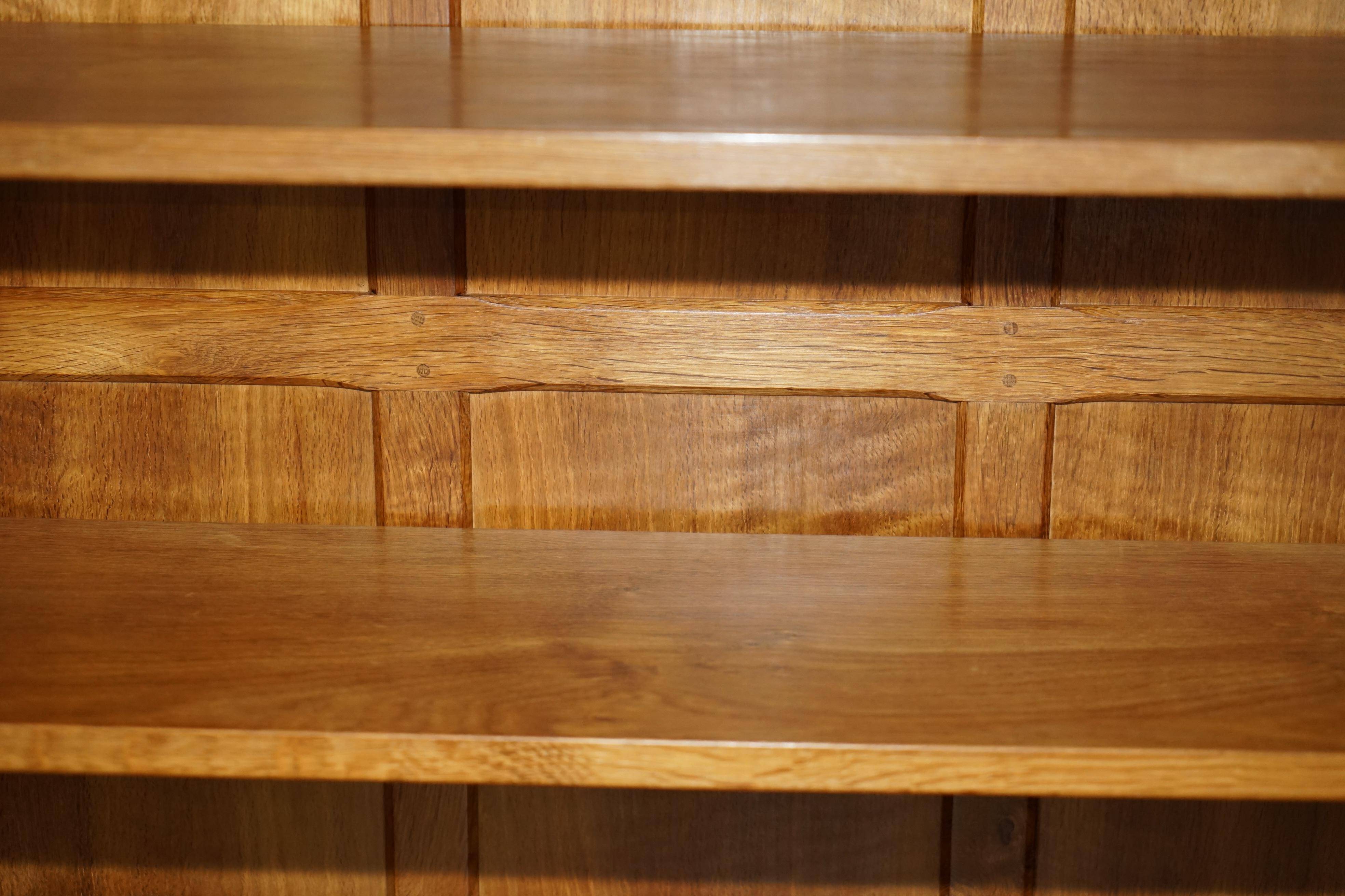 Pair of Robert Mouseman Thompson oak carved bookshelves.