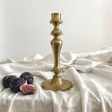 Antique brass candlestick in vintage baluster shape