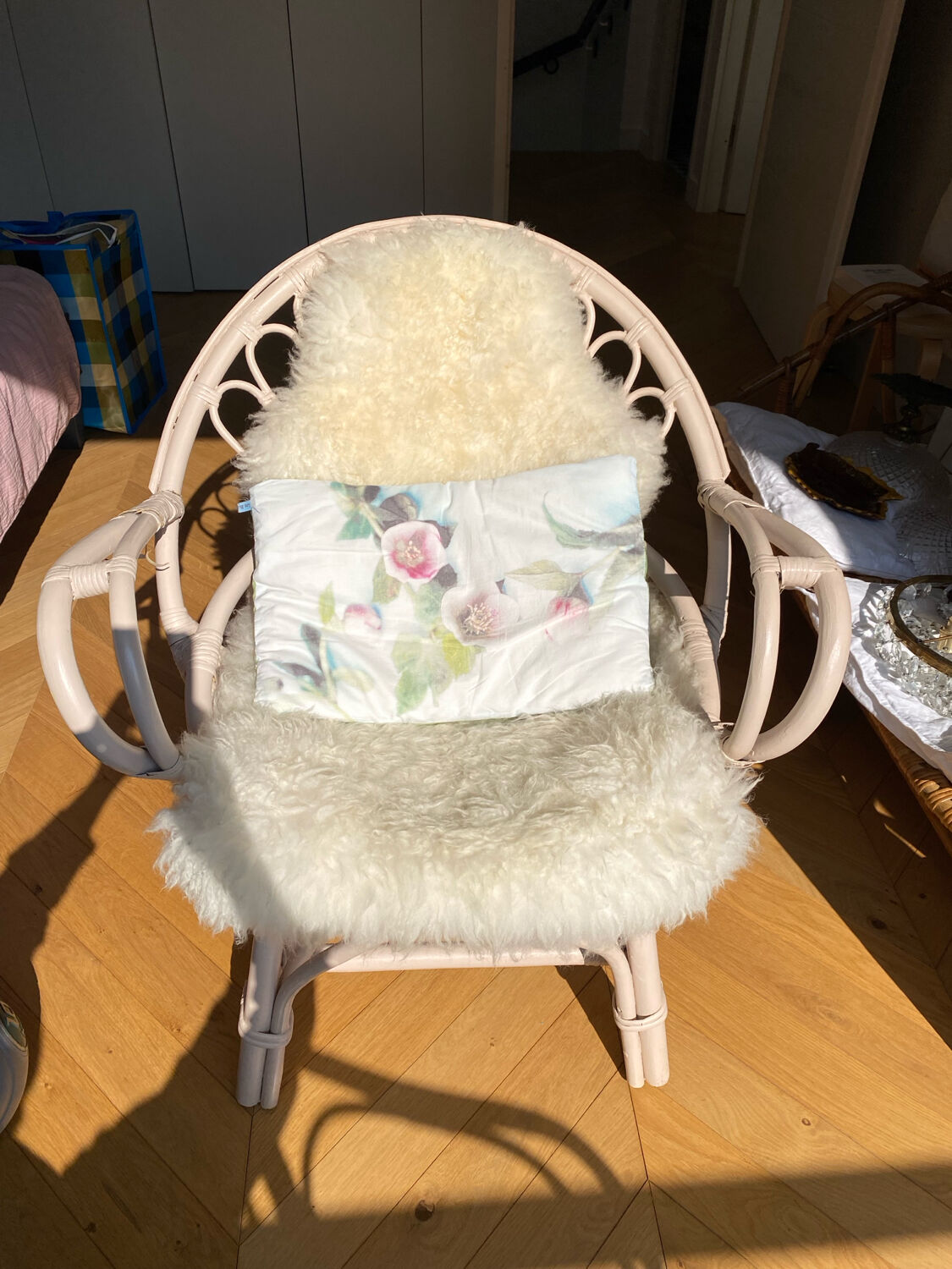 Shell chair in pale pink painted rattan