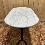 Table bistrot avec plateau ovale en marbre