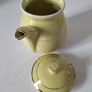 Vintage teapot in pastel yellow earthenware with gold trim